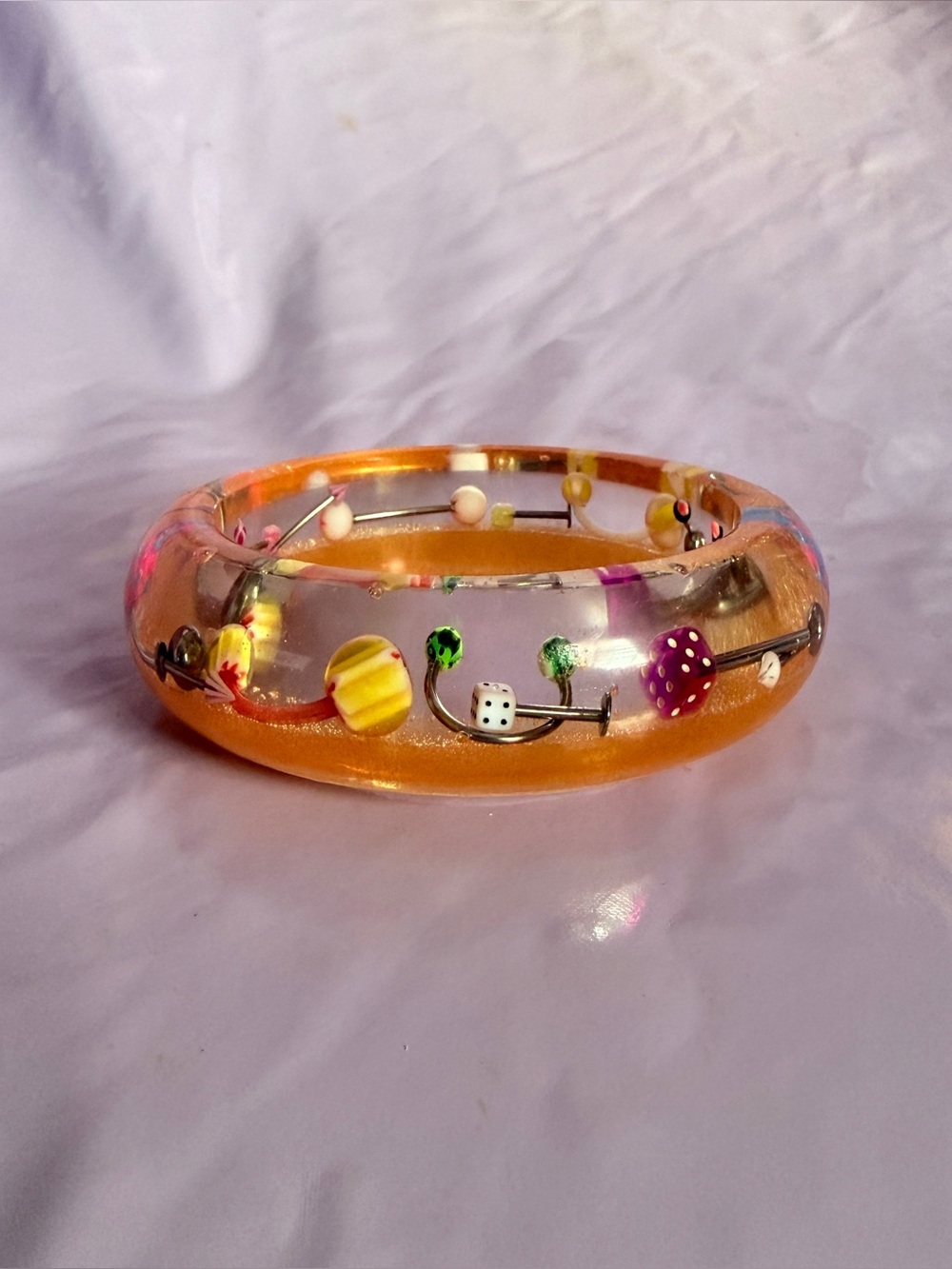 Orange piercing bangle